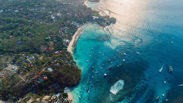 Turquoise bay and tropical coastline from drone at sunset