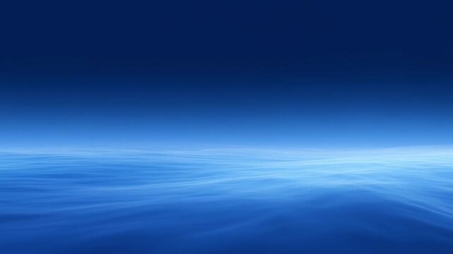 Oceanic Horizon: A serene expanse of the deep blue ocean under a clear sky, with gentle waves creating a mesmerizing, abstract pattern.
