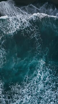 Aerial view of black beach with foam waves Atlantic beach. Sea ocean waves reaching shore