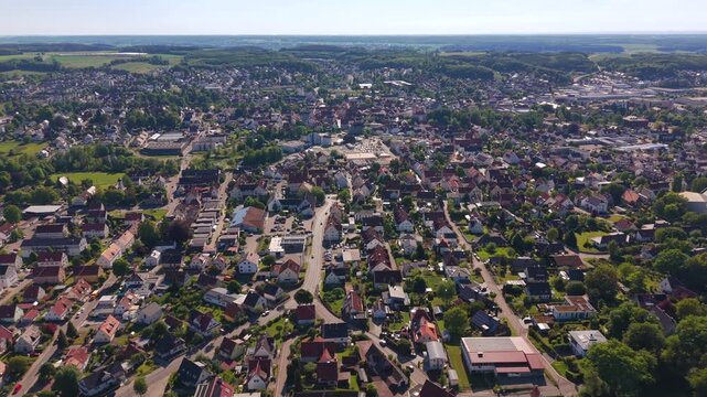 Wide shot of Krumbach, Southern Germany from above. Luftaufnahme und Panoromablick aus der Luft ueber Krumbach. Aerial view of Krumbach in Swabia, Bavaria. Scenic drone view of the urban landscape