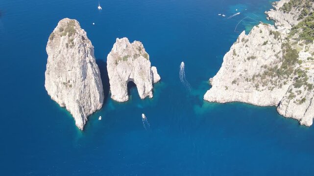 Panoramic drone shot of Faraglioni di Capri and turquoise