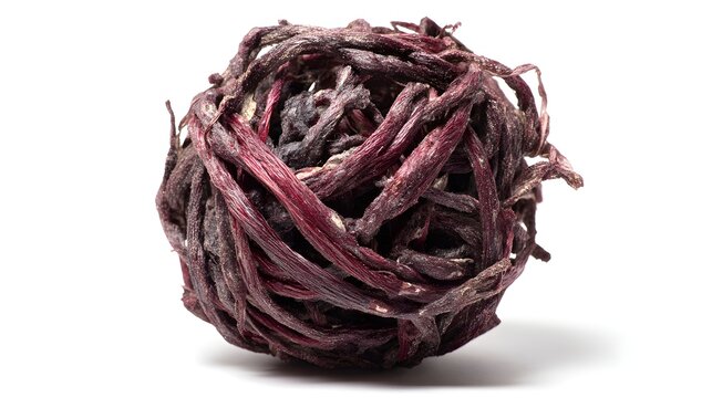 Dried hibiscus tea ball bloom isolated on white background with crisp shadows and spacious layout for editorial text
