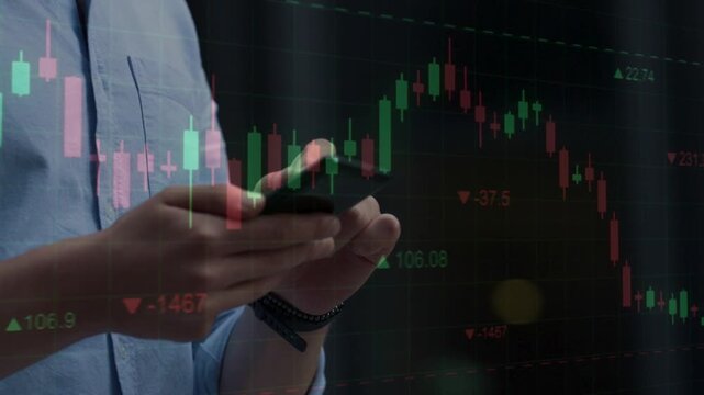Close up of male hands using a smartphone overlayed with transparent candlestick charts and financial market indicators, portraying personal mobile trading.