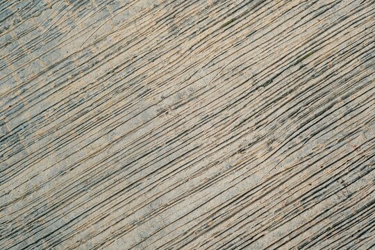 Rough texture of diagonal striped concrete surface with parallel lines