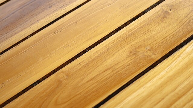 Close up of polished wooden planks with parallel lines