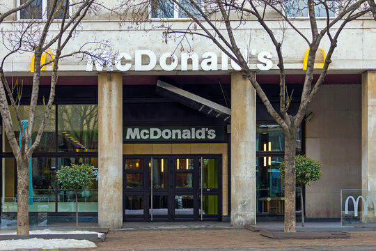 Entrance door of McDonald&rsquo;s fast food chain store restaurant on city street in Belgrade capital of Serbia