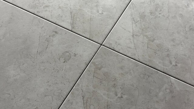 Minimalist grey marble tile texture background with diagonal cross grout lines