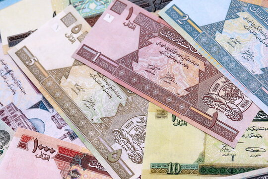Afghan afghani money bills pile on table. Afghanistan banknotes of AFN currency close up.