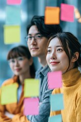 Obraz premium The Brainstorm — Young Asian Entrepreneurs Collaborating on a Bold Project