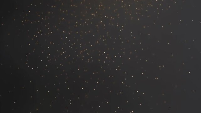 Golden particles floating in dark space create a mesmerizing motion background effect for cinematic projects while glowing specks dance slowly in this high quality abstract digital animation video loo