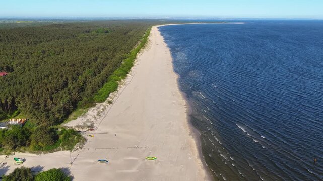 The beginning of a warm spring day on the beach in Jantar.