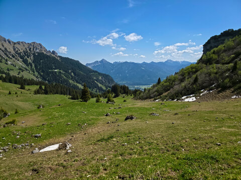 Austria, Majestic alpine cliffs surrounded by conifer forests green meadows and tranquil mountain landscapes on hahnenkamm