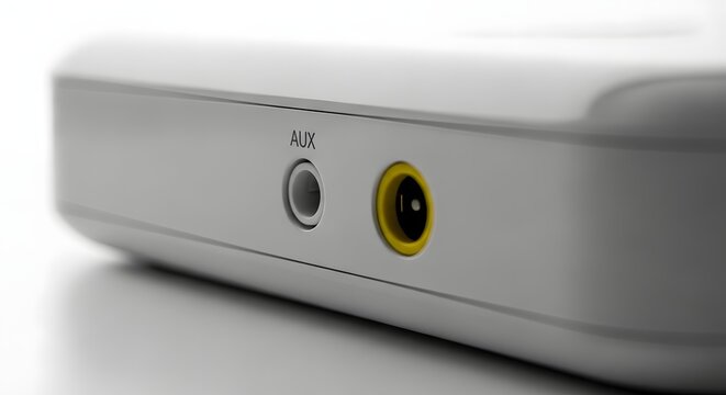 Close up of audio aux and power port on white device