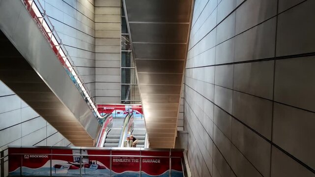 Modern Building Interior with Escalators and Metal Walls in Copenhagen