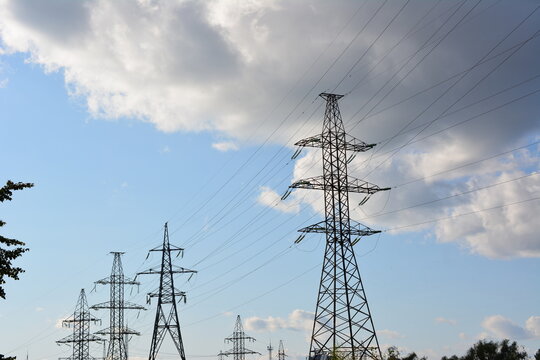 High Voltage Power Lines Against a Cloudy Sky