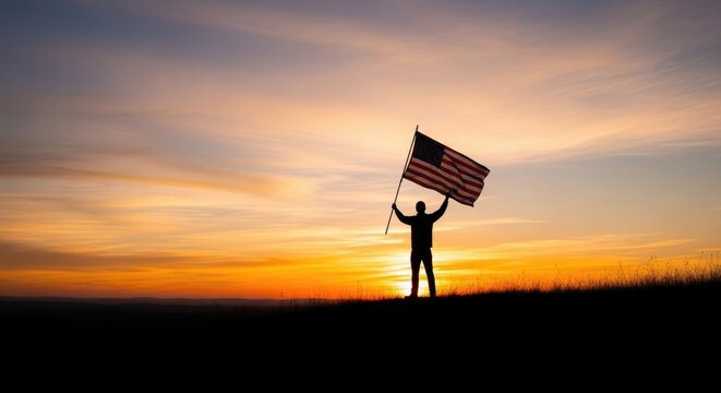 Flag day celebration silhouette of man waving american flag at sunset