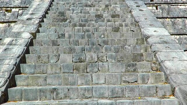Mayan pyramid, great staircase. Ancient mexican temple with stony stairs. View from the base to the top of the structure. Travel footage, mayan ruins, pyramid.