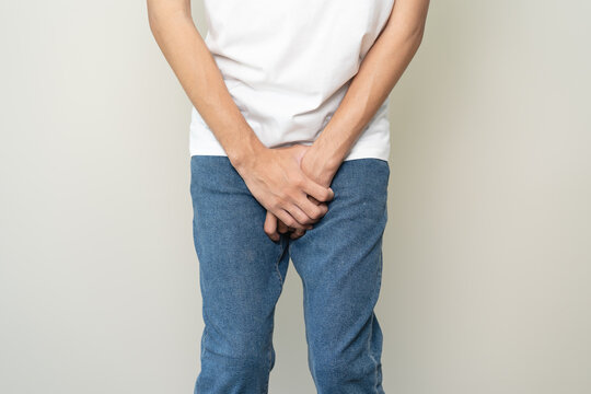 men feeling itching and scratching his crotch