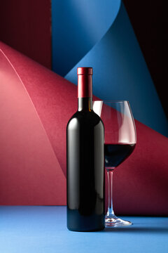 Bottle and glass of red wine.