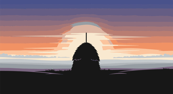 A lone haystack silhouetted against a vibrant, layered sunset sky