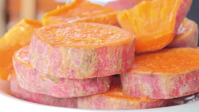Steamed sweet potatoes in a container.