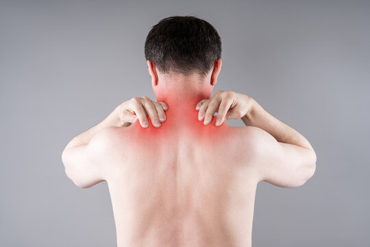 Man suffering from neck and shoulder pain. Massaging tense trapezius muscle. Office syndrome and backache medical concept