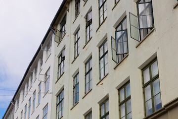 Obraz premium Historic Apartment Building With Open Windows