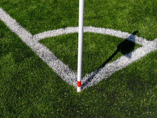 Corner arc and flag shadow on football pitch © Andrey