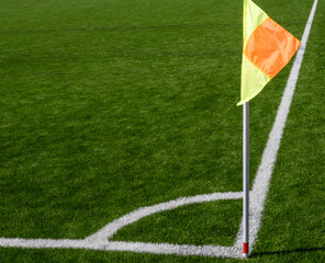 Corner flag on soccer pitch from elevated angle © Andrey