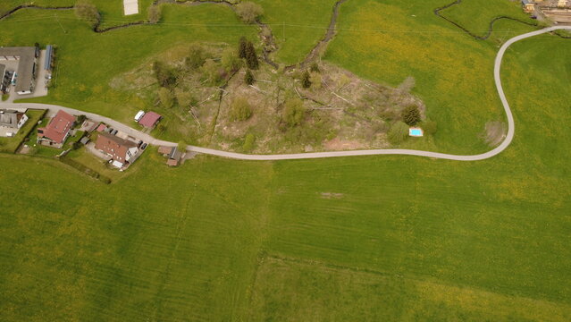 Aerial drone view of farmland fields and rural landscape in spring