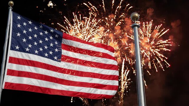 American flag waving with fireworks exploding in the background at night