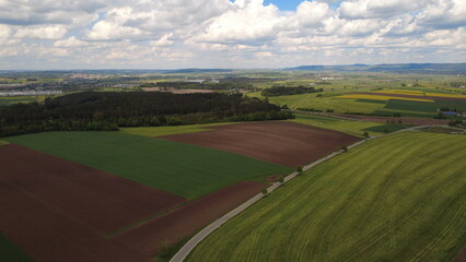 Naklejka premium Aerial drone view of colorful farmland fields and rural countryside