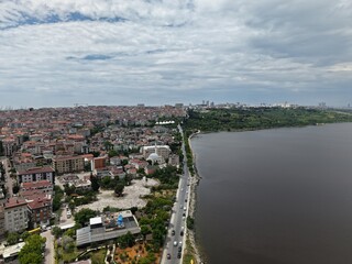 Fototapeta premium Panoramic Aerial Cityscape Under a Dramatic Cloudy Sky