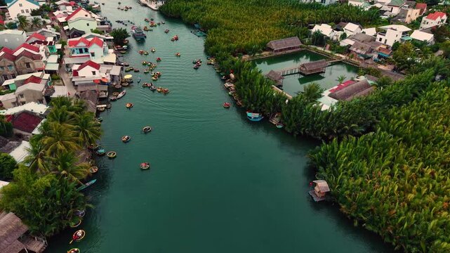 Tourists in basket boats on coconut canal in hoi an, vietnam.