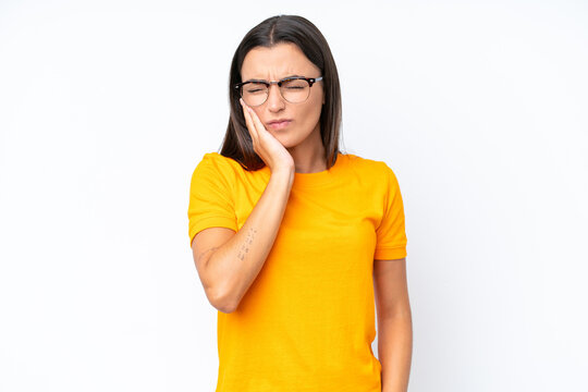 Young caucasian woman isolated on white background with toothache