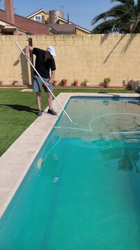 Cleaning Swimming Pool Floor During Summer Pool Maintenance in 4K