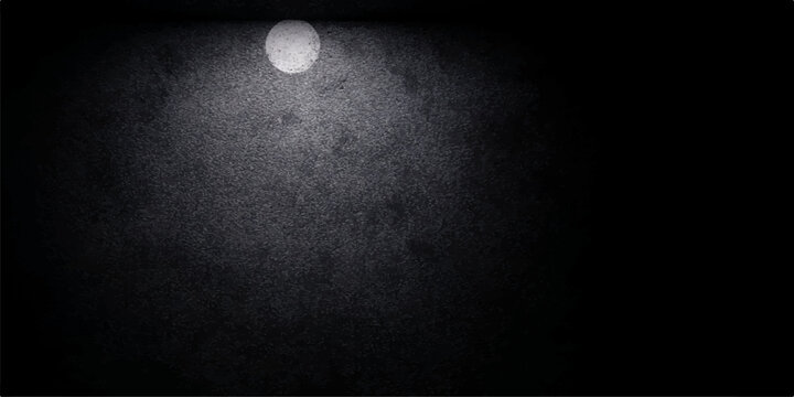 A bright full moon casts a luminous glow across the dark night sky, throwing a stark, natural light on the wall to pierce the black space of the lunar eclipse