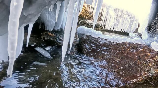 Icicles formed on large boulders by freezing saline sea spray during a winter storm in the Black Sea