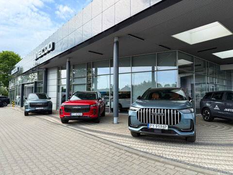 Poznan, Poland &ndash; 0531.2026: Jaecoo J7 and Jaecoo J8 SUVs at an official dealership in Poland &ndash; modern Chinese crossover vehicles in front of a car showroom, European automotive market