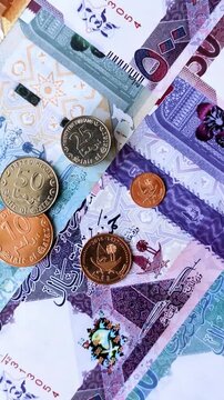 Qatar paper money, the Qatari riyal as a tool for financial transactions and trade. Qatari money as a business background for your design