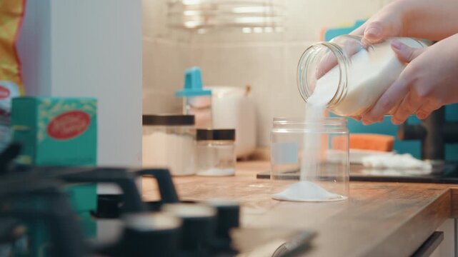 Cooking sugar scene. Scene of confectionery preparations with spices in bustling kitchen environment. Vibrant kitchen scene depicting sugar and spice mixing during dessert crafting process