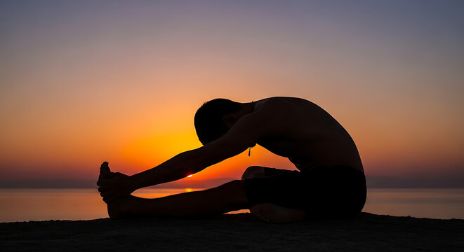 Man stretching his legs during a calm golden sunset