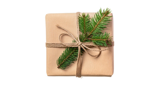 Brown paper gift box tied with twine and decorated with pine branches