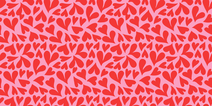 Red hearts seamless pattern on a pink background