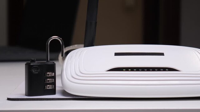 Hands placing an open combination padlock over an internet router, symbolizing data security, network protection, and safeguarding personal information from unauthorized access or cyber threats