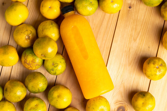 Background and banner, Orange juice pattern, Bottles of tasty juice with oranges and wood background