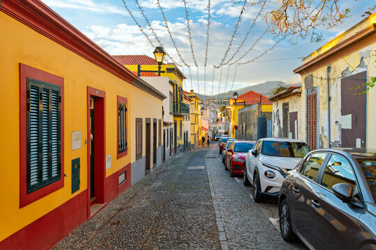 The long and narrow cobblestone Rua de Santa Maria street in the Old Town Zona Velha of Funchal, Madeira, Portugal