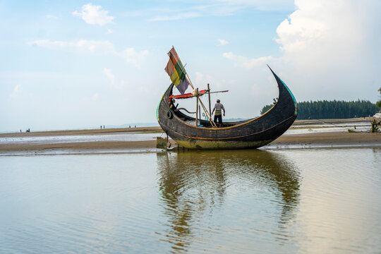 Traditional wooden fishing boat on the beautiful Inani Sea Beach in Ukhia Upazila of Cox&rsquo;s Bazar District, Bangladesh.