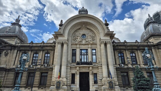 The ornate facade of the CEC Palace on Calea Victoriei under a cloudy blue sky.  Picture taken on May 31, 2026 in Bucharest, Romania.
