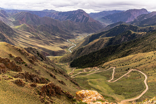 Winding Mountain Road Through Green Canyon Valley with River